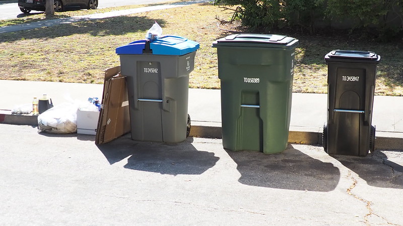 Compost, garbage, and recycling set out on curb