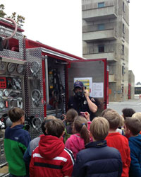 Firefighter Explaining 10 Fire Safety Tips for Everyone