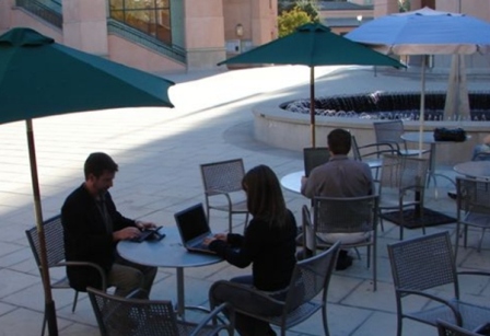 People outside on laptops using City WiFi